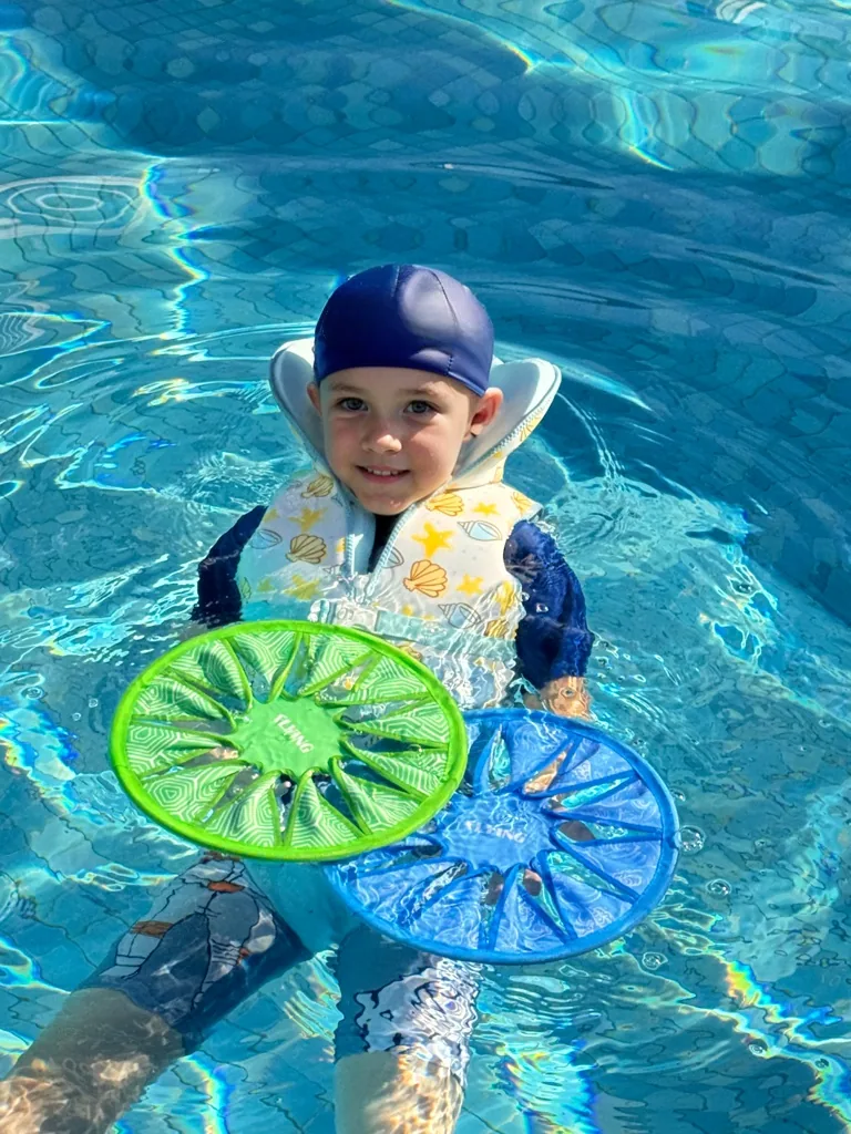 Colorful neoprene flying discs used in pool play