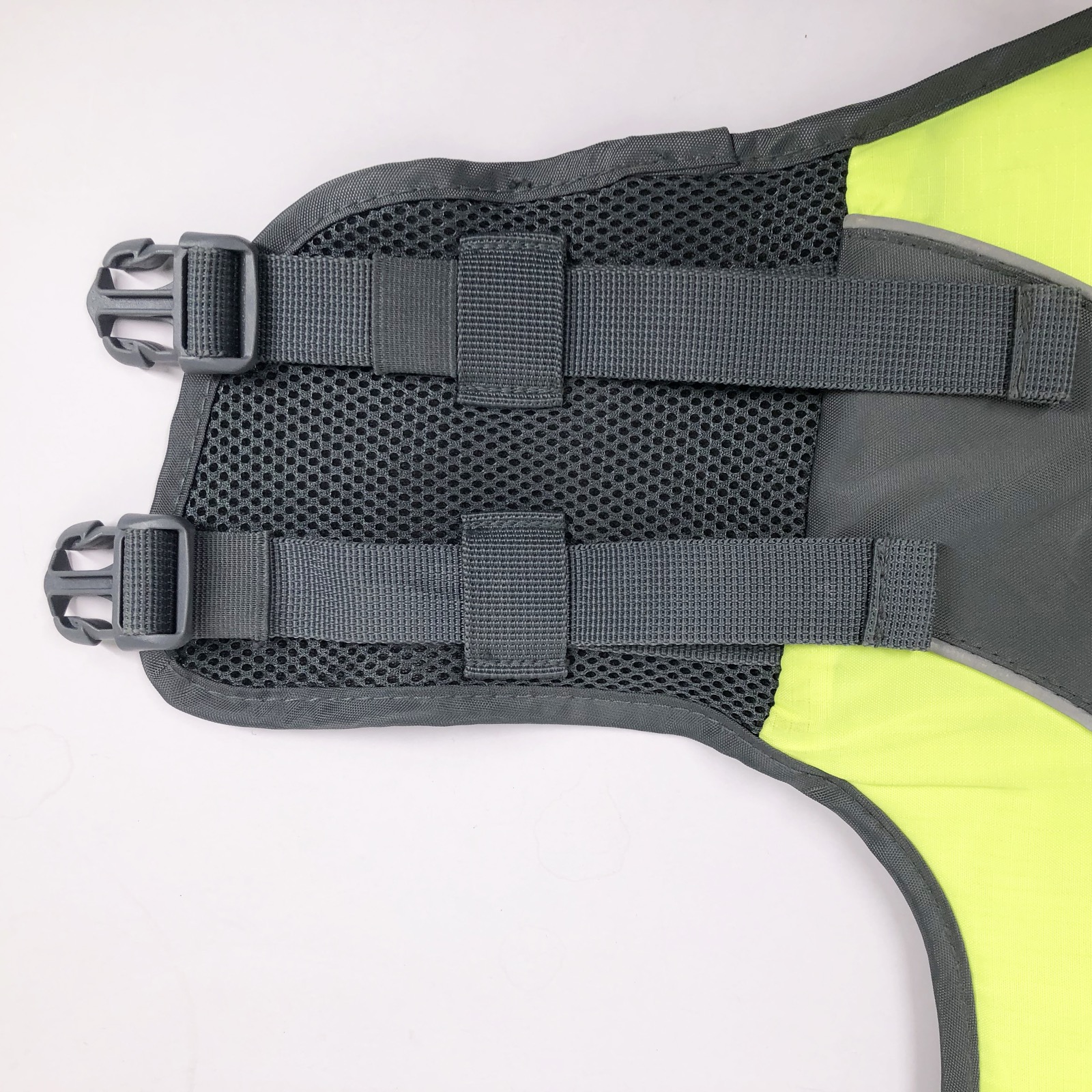 Adjustable webbing and buckle detail on dog life jacket belly panel