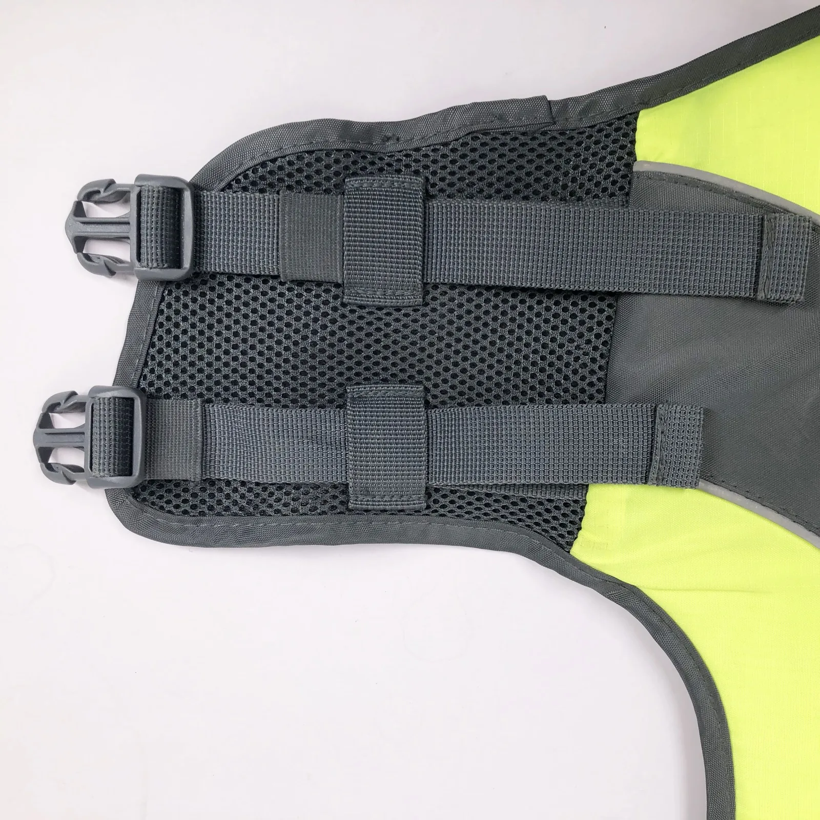 Adjustable webbing and buckle detail on dog life jacket belly panel