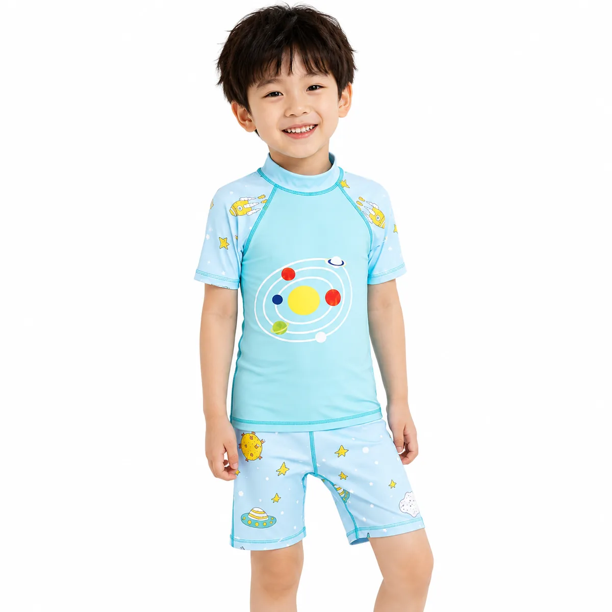 Child wearing matching rash guard and swim shorts set